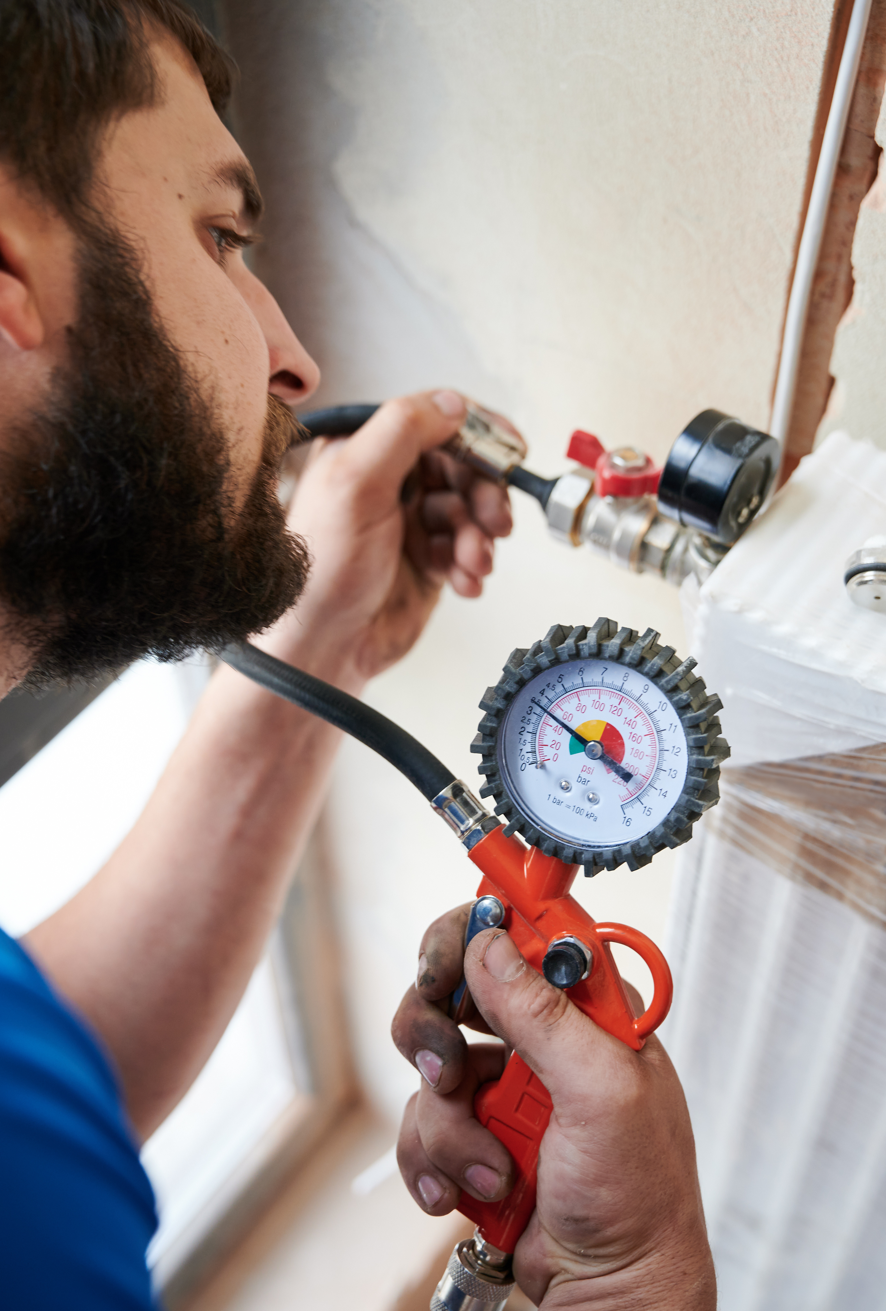 A plumbing expert using plumbing equipment - avoid cheap plumbers in Parma / Seven Hills, OH, and choose WyattWorks; a community plumber.