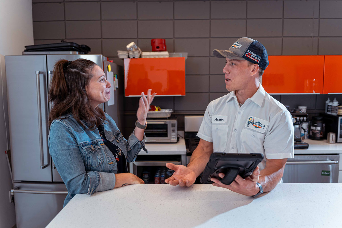 A WyattWorks team member talking to a homeowner and providing services in Huntersville, NC.