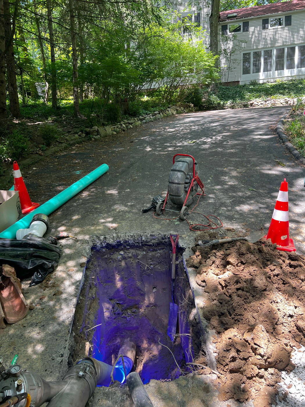 A WyattWorks Cleveland West Side contractor with an electronic pad calculating costs for septic tank pumping services in Seven Hills, OH.
