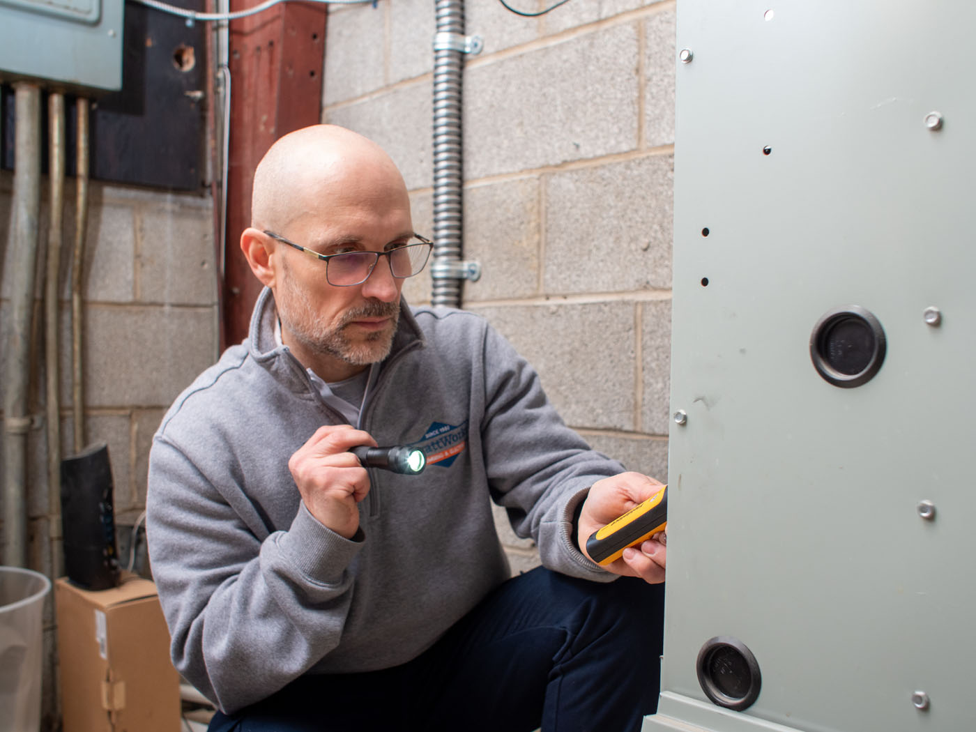 A WyattWorks team member providing heating furnace service in Ohio & North Carolina.