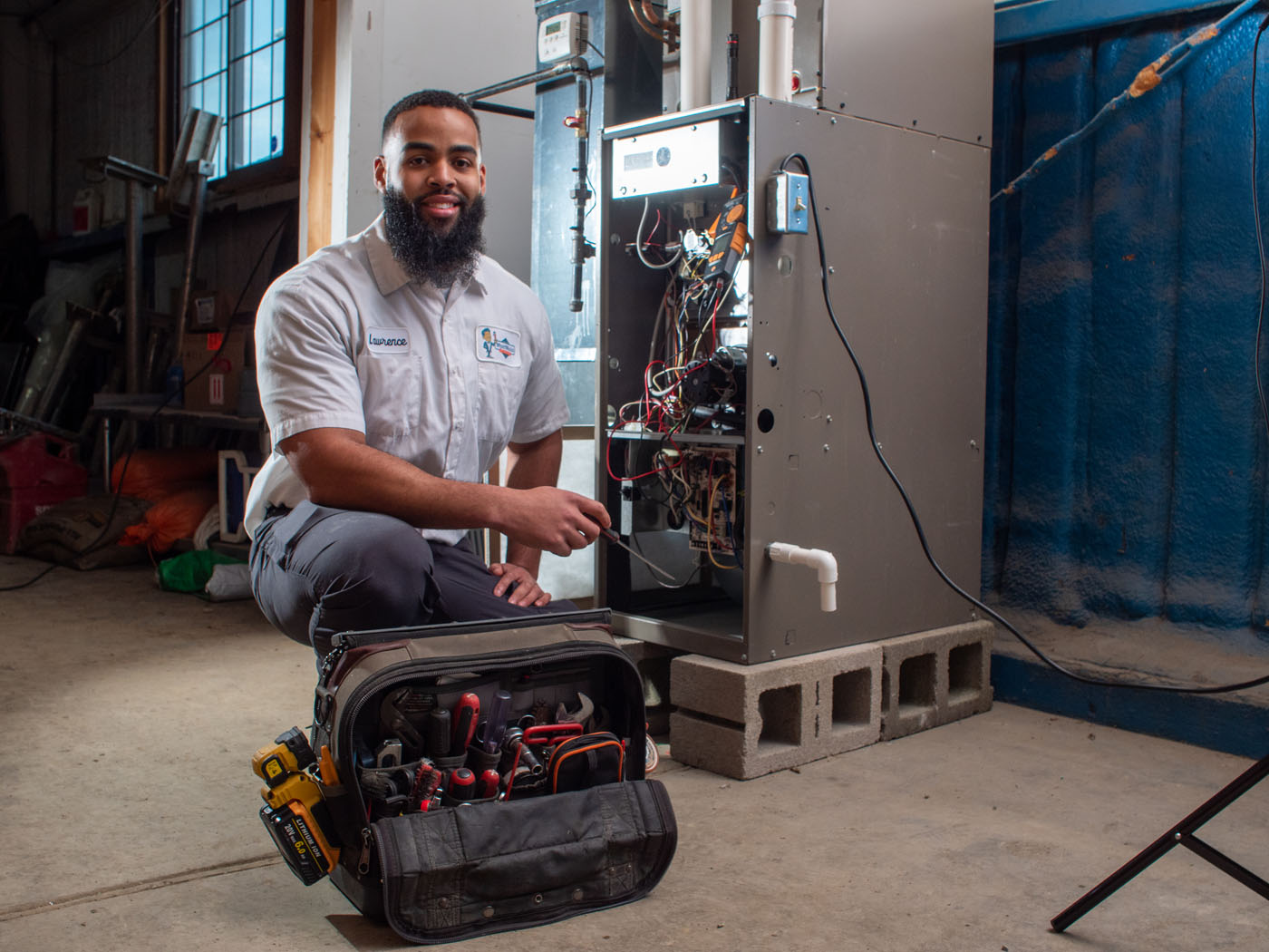 A WyattWorks technician performing heat pump services in Ohio & North Carolina.