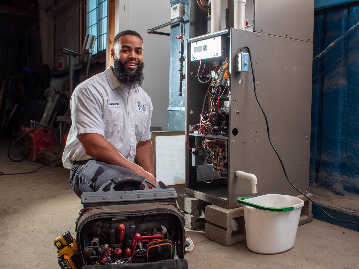 An image of a water heater being serviced by a WyattWorks Plumbing team member.