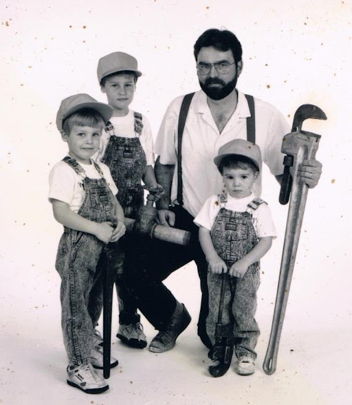An image of WyattWorks founder, Andy Wyatt, and his three sons that carry on their family legacy.