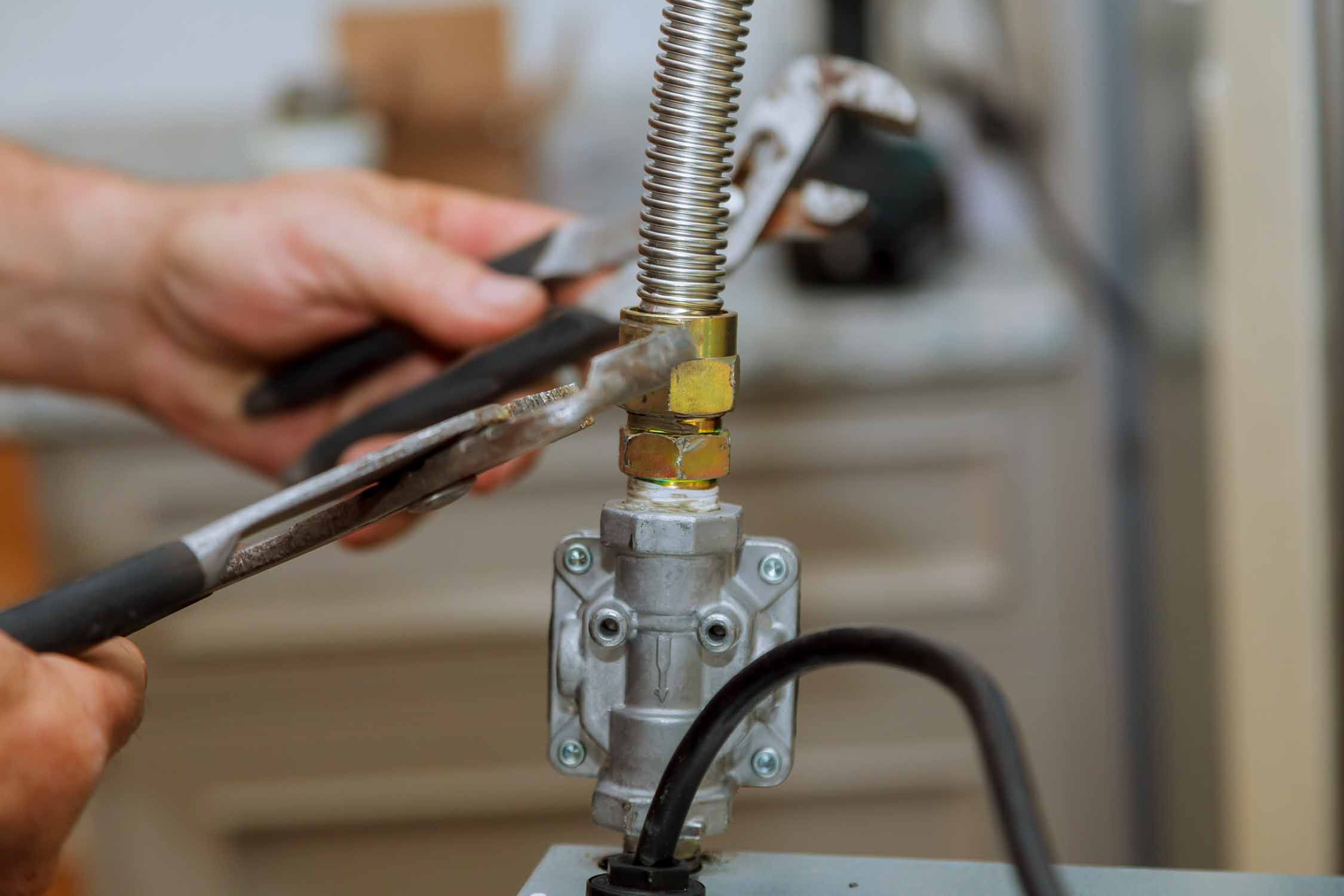 An image of a WyattWorks gas plumber in Seven Hills, OH working on a gas line.