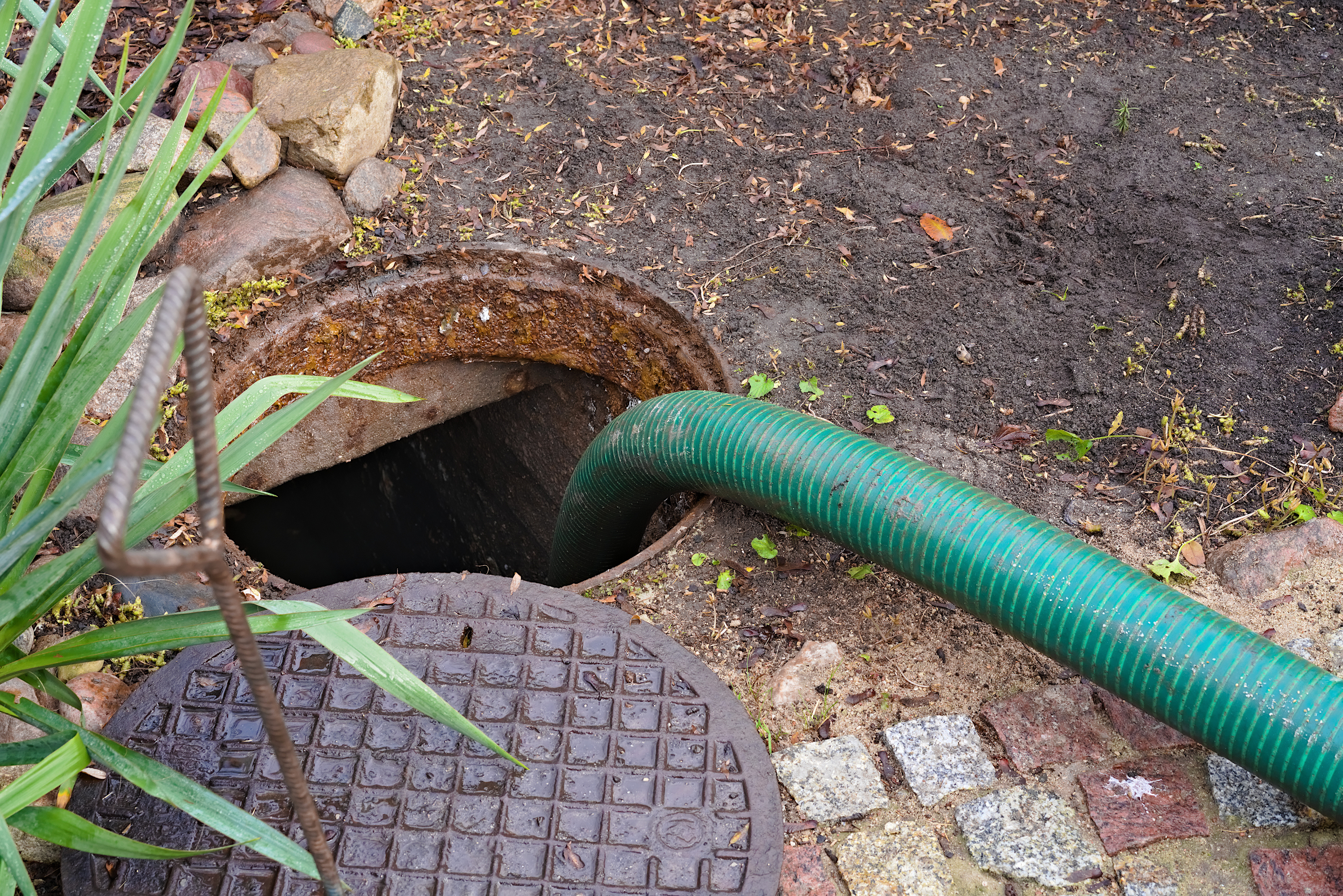 A drain going down to a septic tank - contact WyattWorks for expert septic system pumping in Ohio & North Carolina.