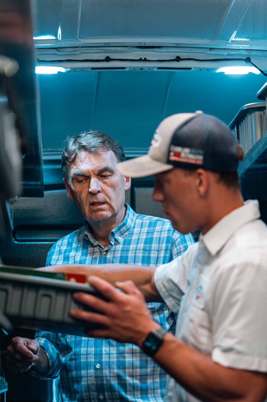 WyattWorks plumbing technicians in the back of our Seven Hills service vehicle.